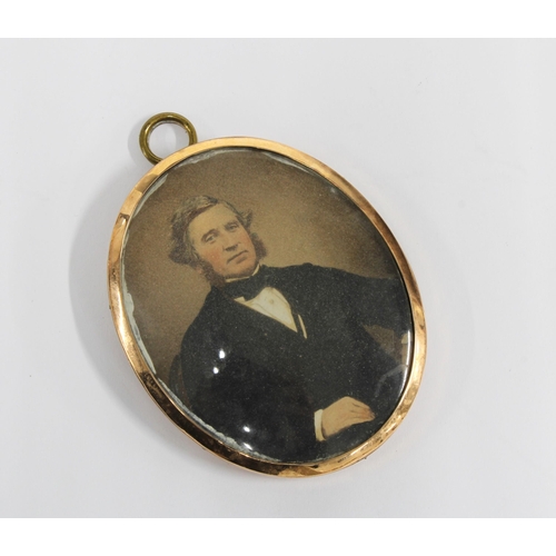 39 - Mourning locket with plaited hair and seed pearls within a yellow metal frame, 7cm