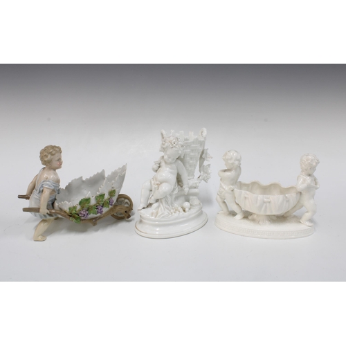 393 - Continental biscuit porcelain figure of a child with wheelbarrow, together with two other white spil... 