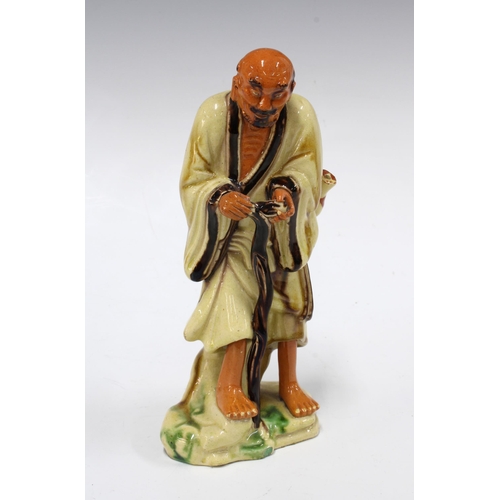 414 - Chinese pottery figure with sancai type glaze, 20cm