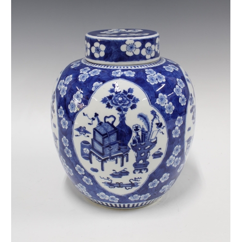 421 - Large Chinese blue and white jar and cover, with prunus ground and panels of precious objects, four ... 