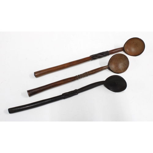 422 - Three wooden Zulu spoons, (3) 37cm