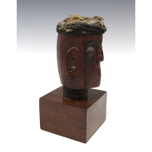 426 - Dayak wooden head on a square plinth base, 27cm