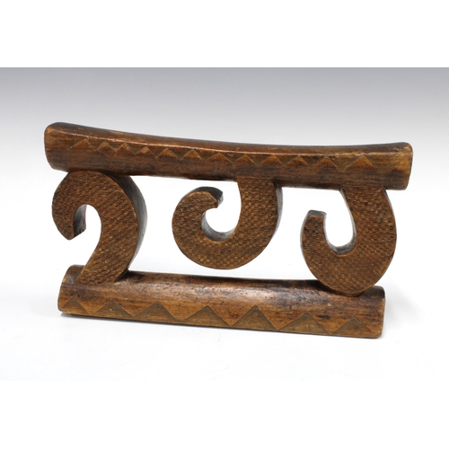 427 - Nguni (South Africa) neckrest, supported on three carved wooden scrolls, 17 x 31cm