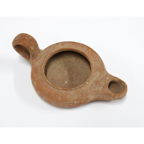 432 - Roman / South Italian terracotta oil lamp, circa 2nd Century AD, 15.5cm long