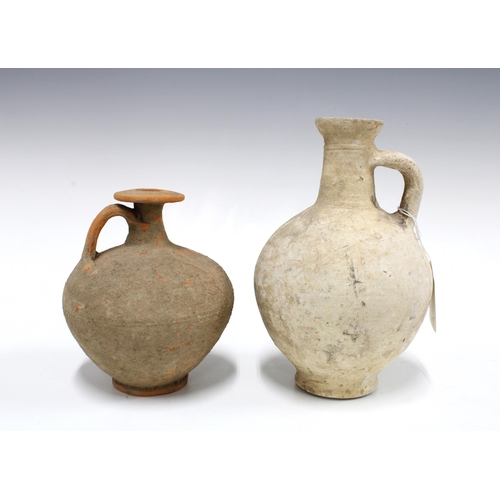 437 - Two ancient  stone vessels to include a wine jug, CA late 1st century AD, and a Roman Palmyre, Ca 3R... 