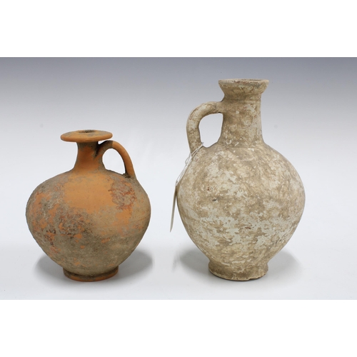 437 - Two ancient  stone vessels to include a wine jug, CA late 1st century AD, and a Roman Palmyre, Ca 3R... 