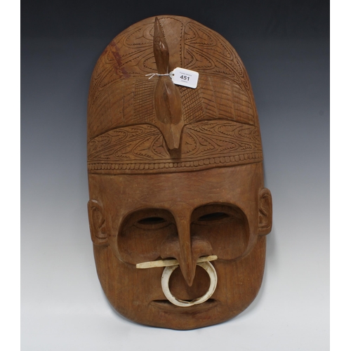 451 - Papa New Guinea wall mask with boar tusk, collected by Kingsford Smith, c.1910, 53cm long