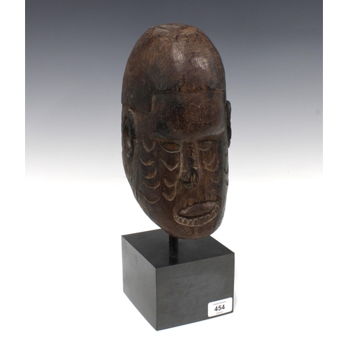 454 - Massim, (Papa New Guinea) carved wooden head on a plinth base, overall height 40cm