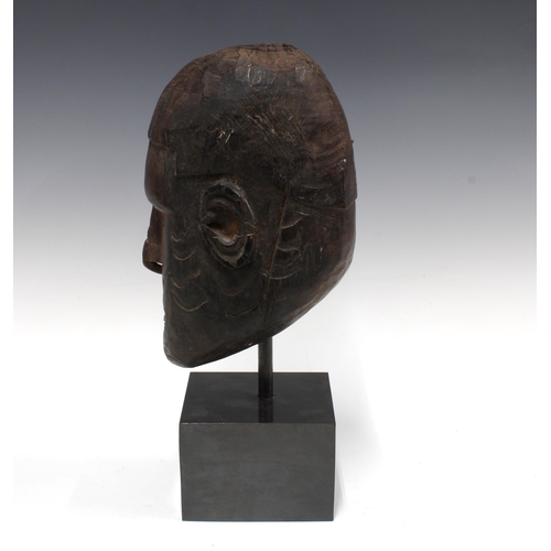 454 - Massim, (Papa New Guinea) carved wooden head on a plinth base, overall height 40cm