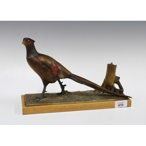 470 - Cold painted spelter pheasant on a wooden base, 32cm long