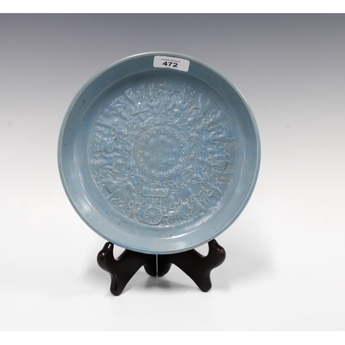 472 - Southeast Asian circular dish, powder blue glaze with a pattern of figures and foliage in relief, 21... 