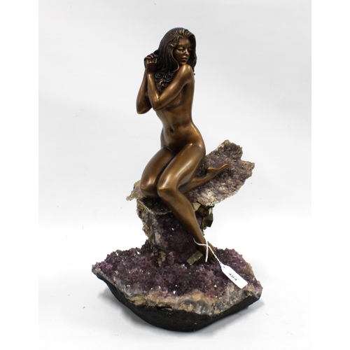 484 - Bronze patinated metal figure of a female nude, on an amethyst quartz base, 42cm