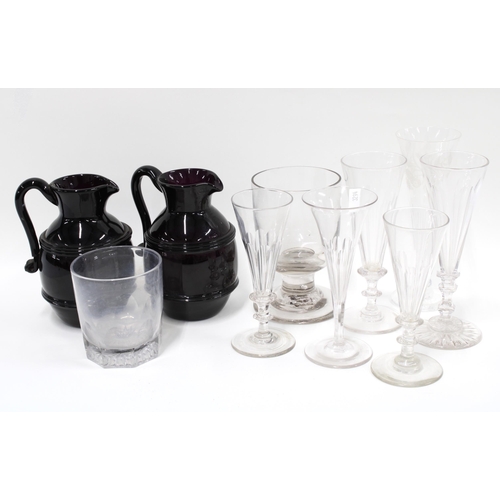 491 - Two early 19th century dark amethyst glass cream jugs, with strapwork handles, 15cm (one a/f) togeth... 