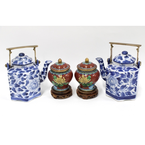 494 - A pair of cloisonne covered vases and two chinoiserie blue and white tea / wine pots (4)