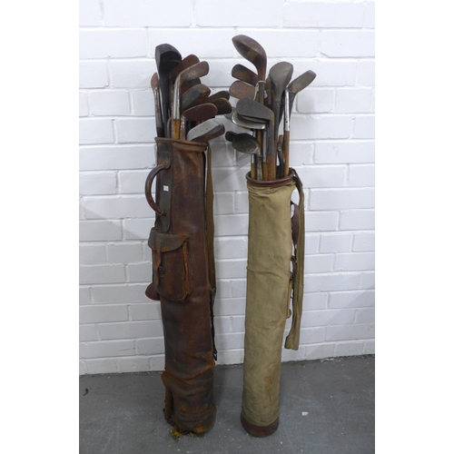 501 - Two sets of vintage hickory shafted golf clubs, (in two golf bags)