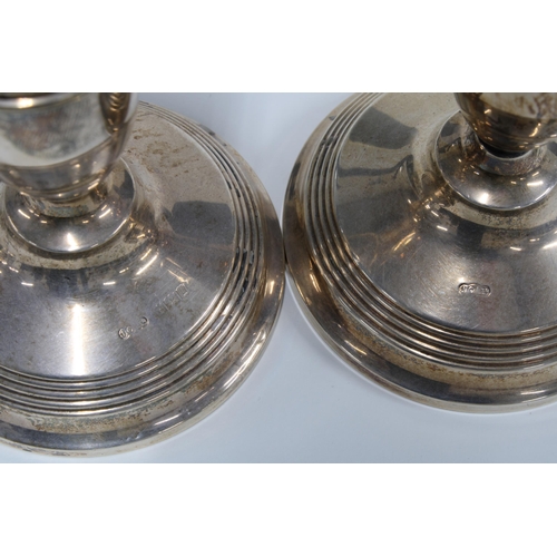 58 - A pair of silver desk candlesticks, Birmingham 1969,  one a/f, 14cm high (2)