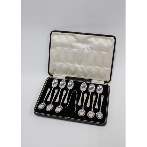 65 - An Edwardian cased set of twelve silver teaspoons with matching sugar tongs, Sheffield 1903