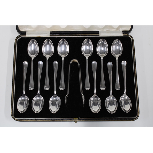 65 - An Edwardian cased set of twelve silver teaspoons with matching sugar tongs, Sheffield 1903