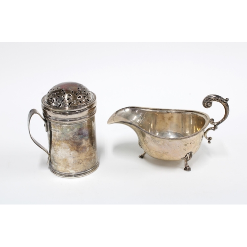 71 - George V silver castor of tankard form with pierced cover, London 1916, 11cm high together with a Bi... 