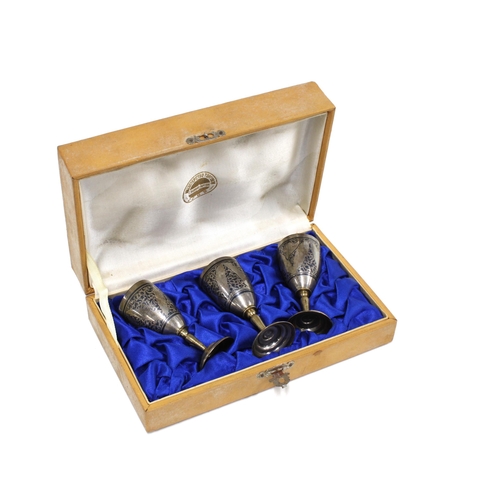 83 - A set of three Russian, Soviet Period silver and niello miniature goblets, stamped 875 with a hammer... 