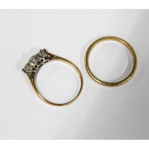 87 - Three stone diamond ring, claw set in yellow metal, the inner band dated 51 with indistinct marks an... 