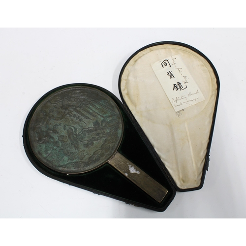 99 - Early 20th century Japanese bronze hand mirror with fitted case and retailed by Garrards, 27.5cm lon... 