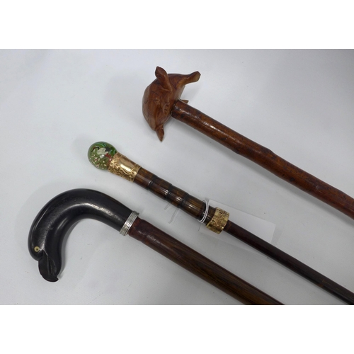 535 - Walking stick with a bird head handle, 97cm, together with a tortoise head stick and cane with paint... 