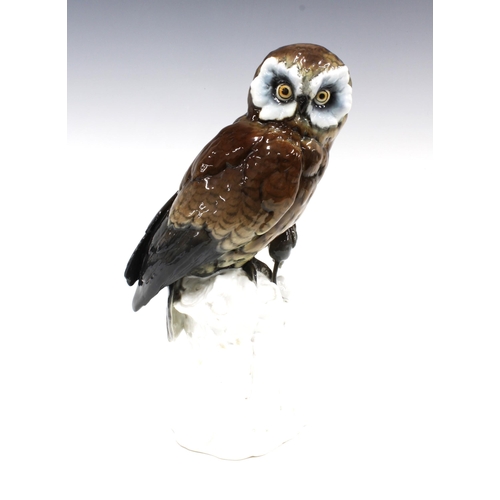 102 - Continental porcelain figure of an owl with mouse on a stump, 31cm