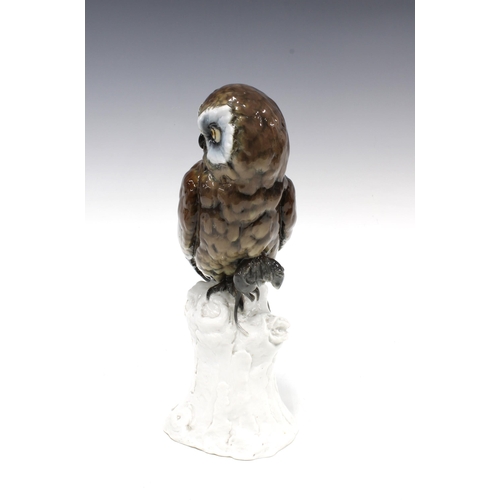 102 - Continental porcelain figure of an owl with mouse on a stump, 31cm