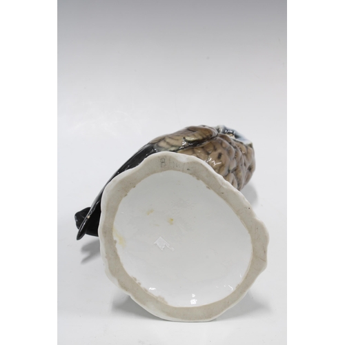 102 - Continental porcelain figure of an owl with mouse on a stump, 31cm