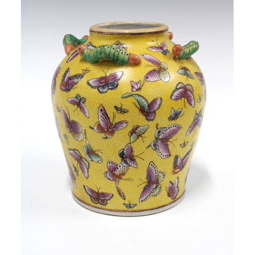 103 - Chinese yellow glazed butterfly vase  applied with caterpillars around the rim, 21cm