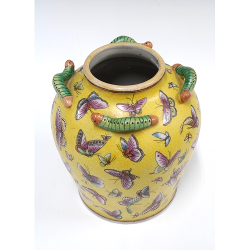 103 - Chinese yellow glazed butterfly vase  applied with caterpillars around the rim, 21cm