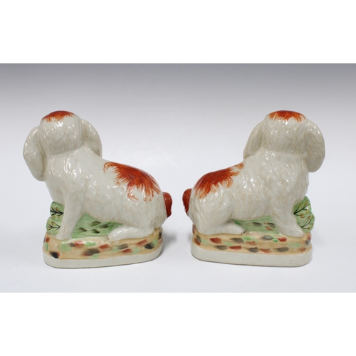 104 - Pair of Staffordshire pottery rabbits, 21cm (2)