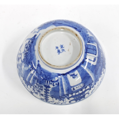 123 - Chinese blue and white Willow pattern bowl, with four character Kangxi marks to the base but likely ... 