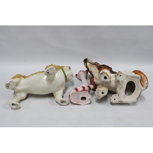 145 - A large Sylvac cat, model number 3457 and two pottery dogs, larger 33cm, (3)