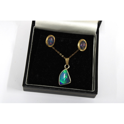 19 - An opal pendant necklace on a 9ct gold chain and a pair of opal earrings (2)