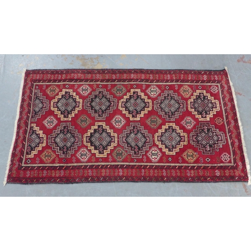 201 - Persian Kazak style rug with red field with multiple borers, 197 x 109