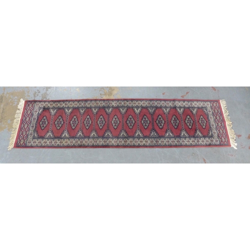 202 - Pakistan runner with pink / red faded field 304 x 76cm