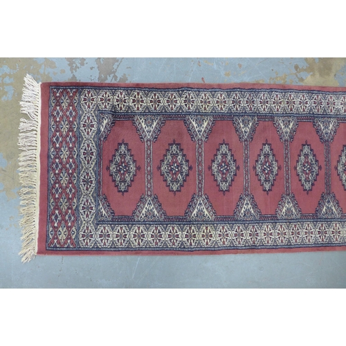 202 - Pakistan runner with pink / red faded field 304 x 76cm