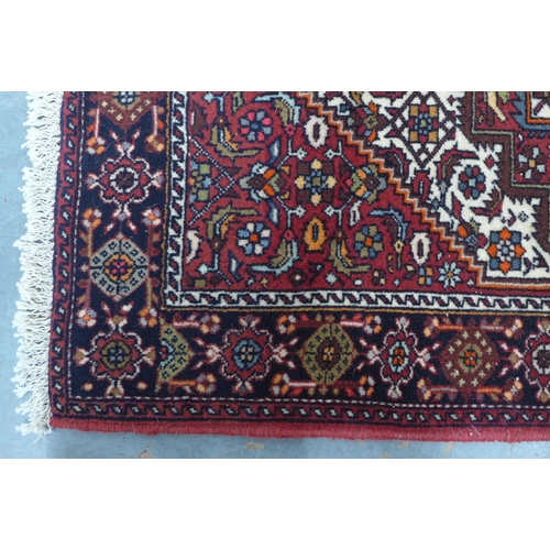 204 - Persian Gholtogh  / Goltok  with rug red field  and central lozenge, 117 x 75cm