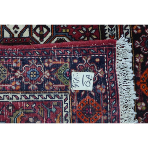 204 - Persian Gholtogh  / Goltok  with rug red field  and central lozenge, 117 x 75cm