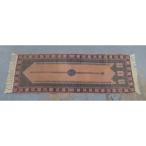 205 - Moroccan runner with salmon pink field and a pole medallion, 228 x 78cm