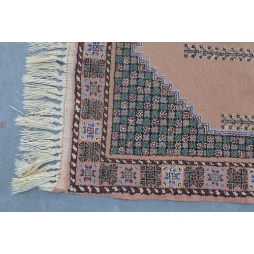 205 - Moroccan runner with salmon pink field and a pole medallion, 228 x 78cm