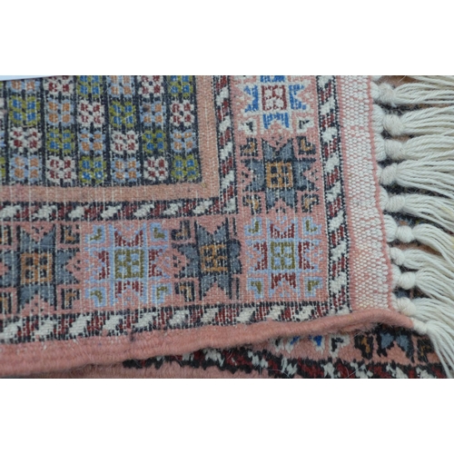 205 - Moroccan runner with salmon pink field and a pole medallion, 228 x 78cm