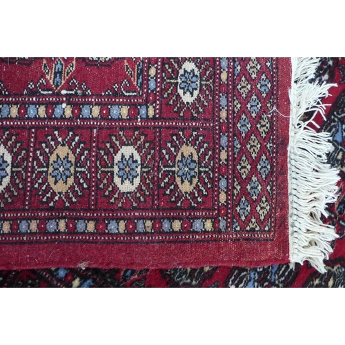 207 - Pakistani bokhara runner with red field 244 x 82cm