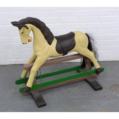 214 - Child's painted rocking horse, on a trestle base, 90 x 75cm