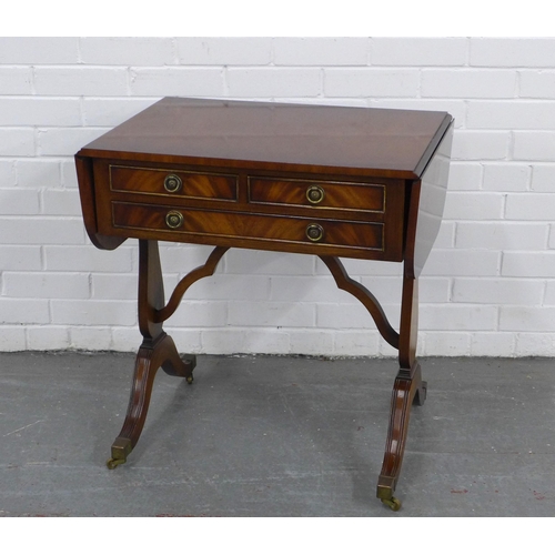 216 - Mahogany reproduction sofa table with three drawers and brass casters, 67 x 71 x 46cm