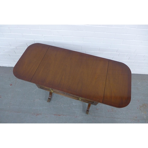 216 - Mahogany reproduction sofa table with three drawers and brass casters, 67 x 71 x 46cm