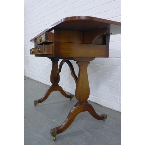 216 - Mahogany reproduction sofa table with three drawers and brass casters, 67 x 71 x 46cm