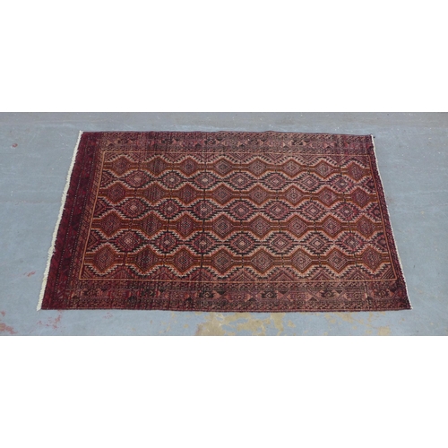 217 - An Afghan Belouch rug with red field 190 x 112cm